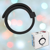 A black headband with a Velcro closure is displayed in front of a pastel, bokeh-effect background. The packaging box for the headband, featuring the brand name "Velv'Or" and an illustration of the Velv'Or Rooster Jason Adjustable Hard Silicone Cock Ring, is positioned in the bottom right corner of the image.